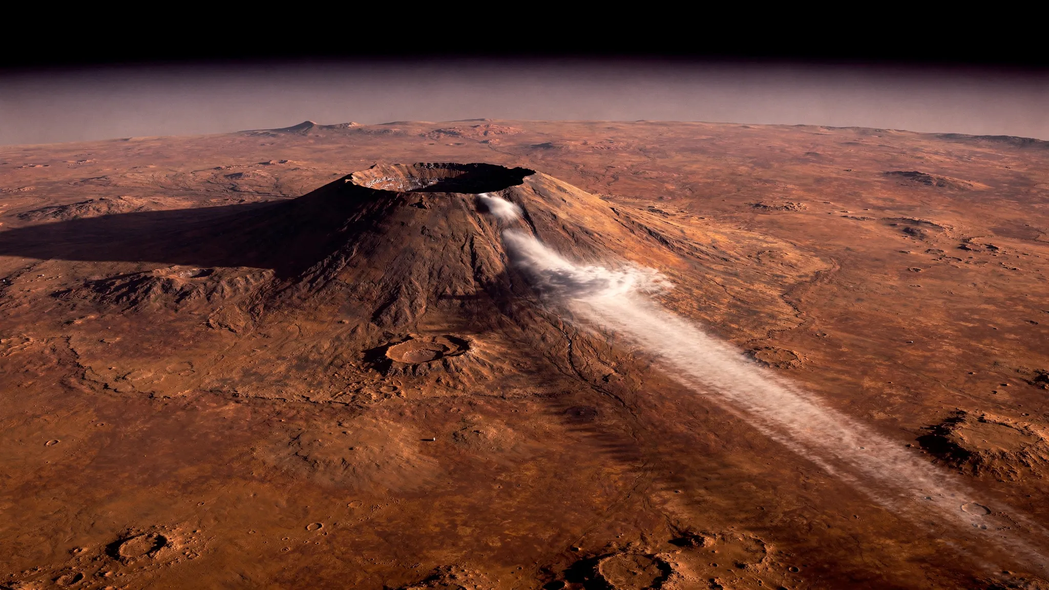 Mars seen from orbit in the morning: a long thin white cloud streaming west from the flank of the volcano Arsia Mons.